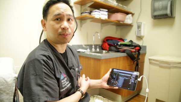 Dr. James Tsung, MD, showcases a lung ultrasound display on a tablet.