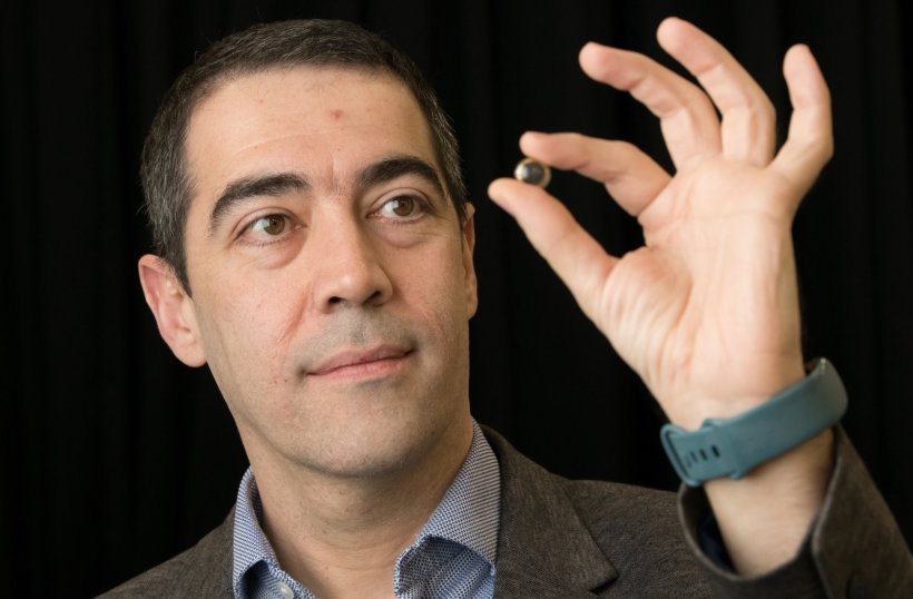 Professor Hamdi Torun, pictured holding the contact lens, developed to detect...