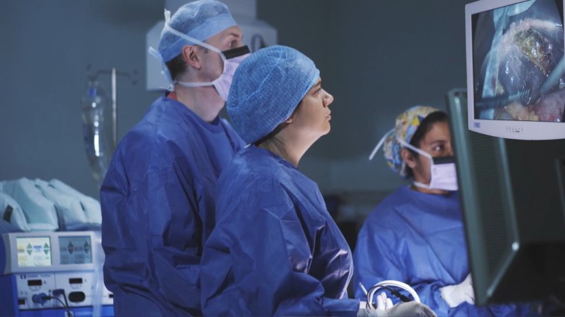 Surgical team in an operating theatre, working on a patient