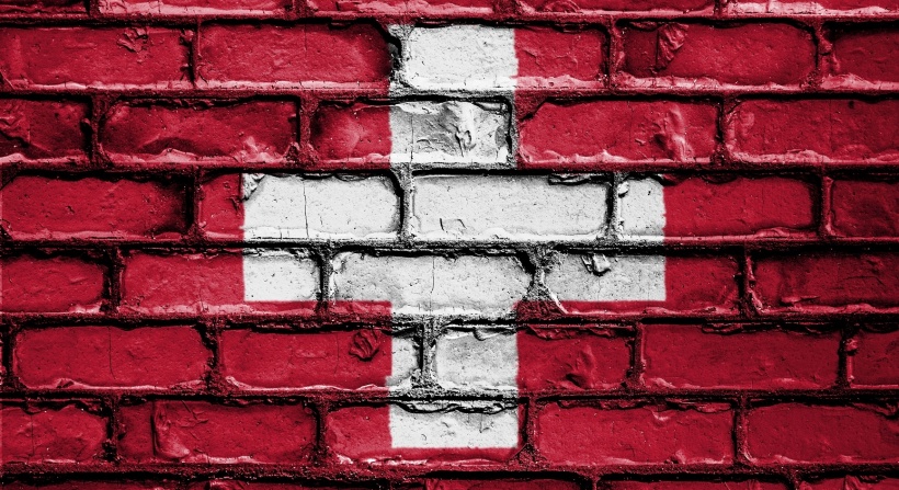swiss flag on a brick wall