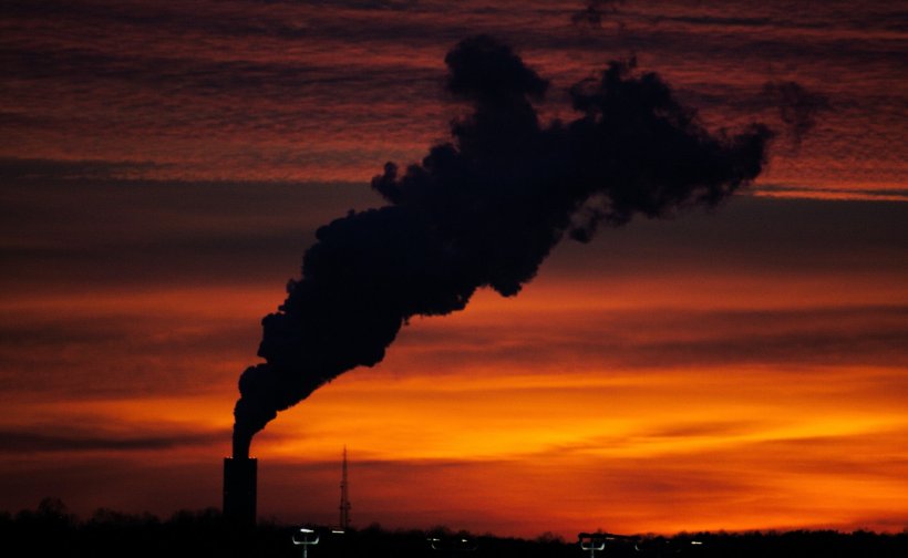 factory smoke silhouette on sunset backdrop