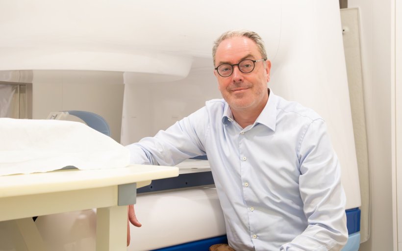 Prof. Aswin L. Hoffmann with the current generation “in-beam MRI. Using an...