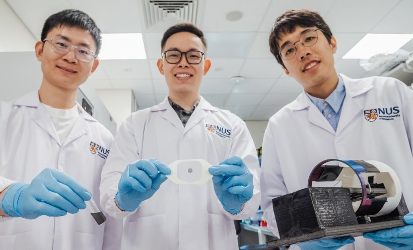 Asst Prof Andy Tay (centre) is holding a plaster pre-loaded with magnetic gel,...