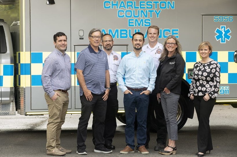 Some members of team working to equip ambulances with MRIs. (Left to right)...